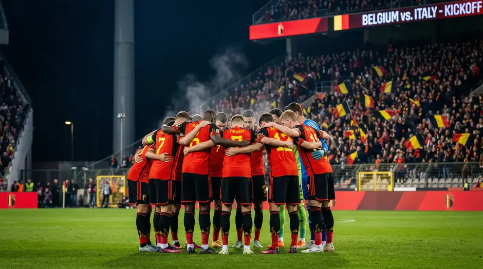 Joueurs de l'équipe nationale de Belgique en maillot rouge sur le terrain de football
